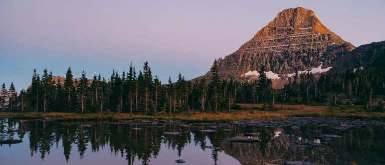 Glacier national park mountain reflection on a serene lake