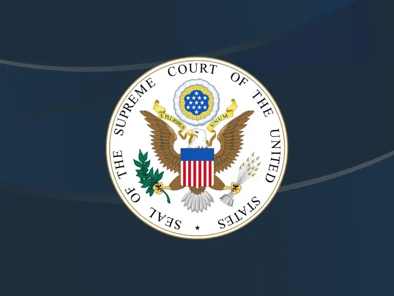 Photo is an image of the Supreme Court logo